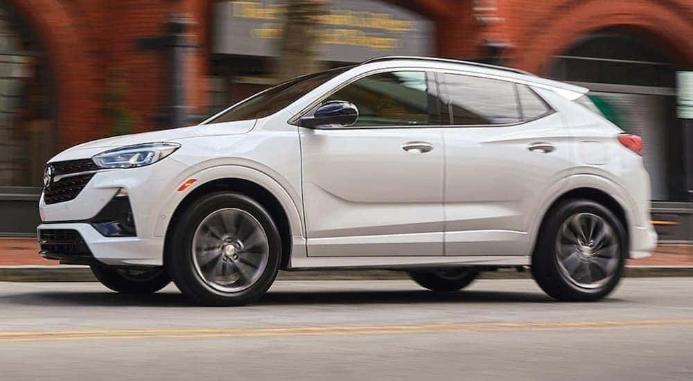 A white 2021 Buick Encore GX is shown from the side after leaving a used Buick dealership near Lexington.