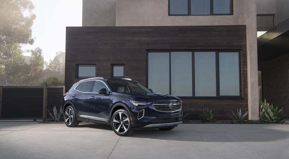 A black 2021 Buick Envision is shown from the front at an angle.