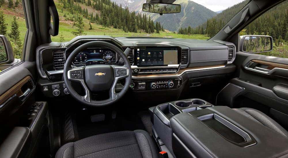 The interior of a 2024 Chevy Silverado 1500 LT is shown from the driver's seat.