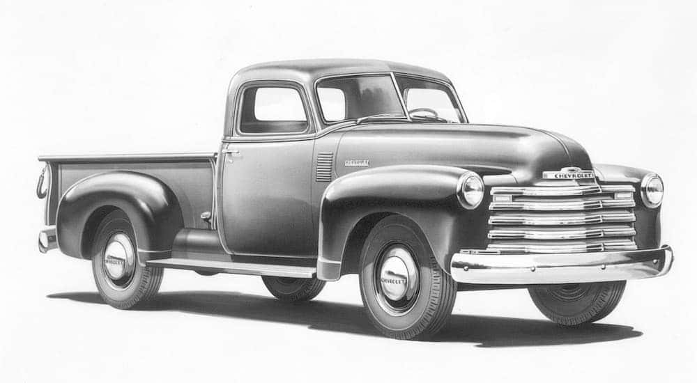A black and white picture is showing a 1948 Chevy 3100 angled right.