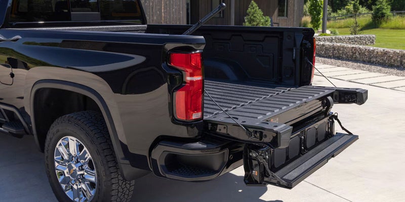 Chevrolet Silverado HD trunk open to add supplies during the day